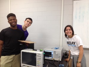 Undergraduates and high-school student testing their monopole antenna.