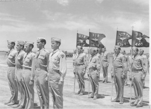Squadron Commanders and guidons 319th Bomb Group in formation to receive Awards. Photograph from the B-26 Marauder Archives, 319th Bombardment Group Reunion  Association, Archival Services, University Libraries, The University of Akron 