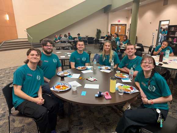 USG Members posing at a table at our Spring Retreat.