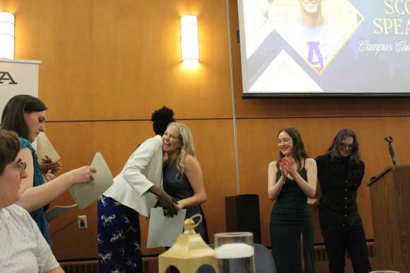 Members receiving superlatives at our end of year awards ceremony.